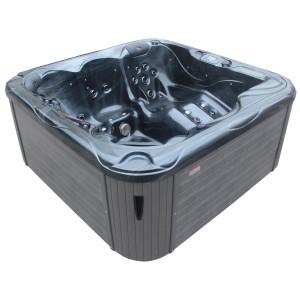 Spa extérieur noir Sonnenkönig Sansibar avec habillage gris et jets de massage.