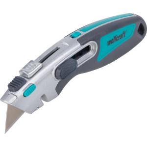 Couteau de sécurité professionnel Wolfcraft avec lame trapézoïdale, gris/turquoise, avec curseur et magasin de lames.