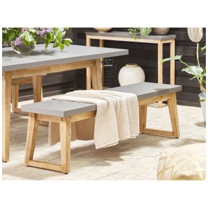 Banc de jardin gris Beliani Oria en fibrociment avec pieds en acacia et serviette.