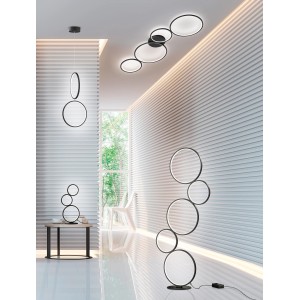 Lampadaire LED Trio Rondo moderne, noir mat, avec design circulaire dans le salon.