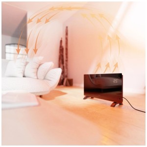 Convecteur Hombli Smart Black Glass 2000W dans le salon. L'air chaud circule, affichage 25°C. Chauffage efficace.