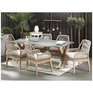 Ensemble de jardin Beliani Olbia: Table en fibrociment gris avec piètement bois et 6 chaises tressées avec coussins clairs.