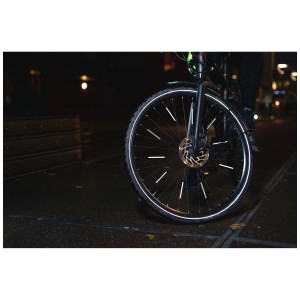Vélo avec réflecteurs de rayons Abus Lumino gris pour une meilleure visibilité dans l'obscurité.