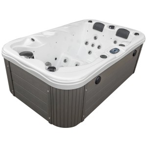 Planet Spa Bain à remous Vira pour 2 personnes, bain à remous fixe avec habillage gris et cuve blanche.