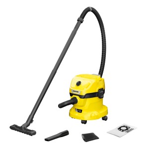 Aspirateur eau et poussière sans fil Kärcher WD 2-18 avec accessoires tels que buses et sac filtrant.