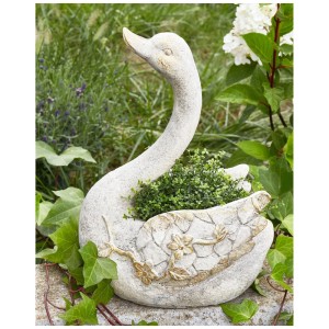 Weisse Schwan Gartenskulptur aus Magnesiumoxid mit Übertopf, kupferfarbenen Details und verwitterter Optik.