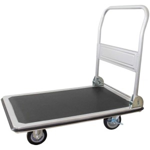 Carrello a piattaforma Puag grigio antracite con superficie in gomma antiscivolo e maniglia pieghevole.