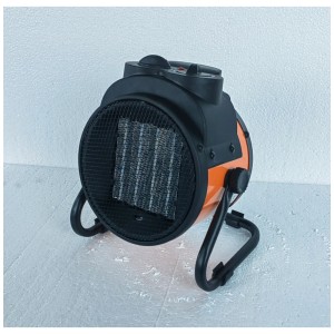 Chauffage soufflant céramique portable noir et orange, puissance 2 kW, avec grille de protection et commandes rotatives.