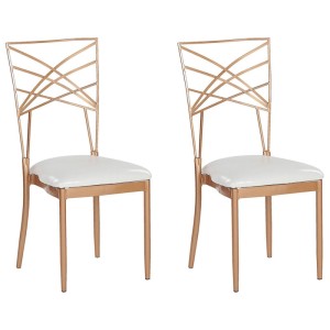 Set di 2 sedie da pranzo Beliani Girard in oro rosa con rivestimento in ecopelle bianca.