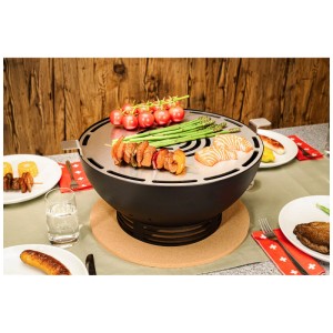 Grill de table rond Nouvel Tavolo noir en acier inoxydable avec des aliments grillés.