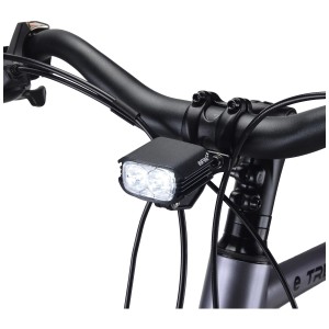 Éclairage avant pour vélo électrique Infini Lumens LED, aluminium, blanc, monté sur le guidon.
