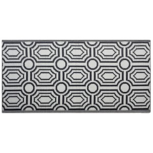 Schwarz-weißer Outdoor-Teppich mit geometrischem Muster, beidseitig nutzbar, aus robustem Polypropylen.