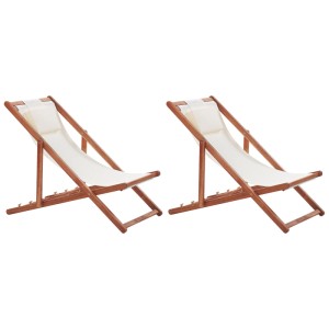 Set di 2 lettini da giardino Beliani Avellino in legno di acacia con rivestimenti color crema.