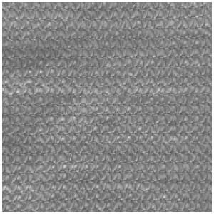 Gros plan de la voile d'ombrage triangulaire grise Windhager Capri, texture du tissu HDPE visible.