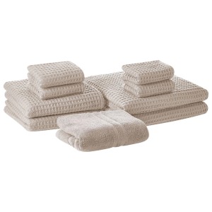 Ensemble de 9 serviettes de bain beige Areora avec tapis de bain en coton et texture gaufrée.