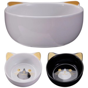 Gamelle en céramique pour chat, noire et blanche, avec oreilles de chat.