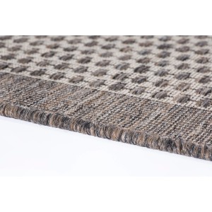 Gros plan du tapis marron Andiamo Savannah (57x110 cm) avec motif à pois.