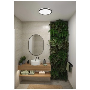 Panneau LED noir Paulmann Atria Shine, Ø 40 cm, dans salle de bain moderne avec mur végétal.