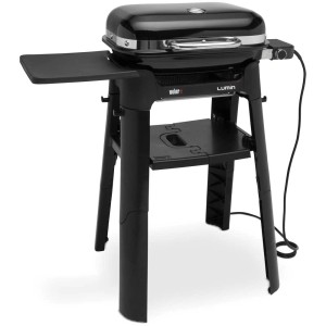 Weber Lumin Compact barbecue elettrico con supporto, tavolo laterale e ripiano in nero.