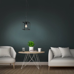 Suspension noire Briloner au design vintage au-dessus d'une table avec décoration.