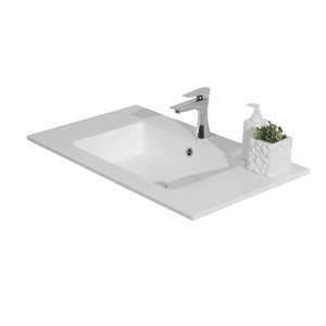 Vasque en fonte minérale blanche (80,5x46cm) avec robinet et décoration.