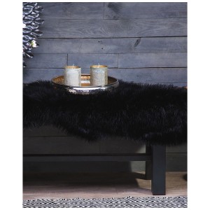 Schwarzer Kunstfell-Teppich Mungo in Schaffell-Optik, 88x53 cm. Weiches, dekoratives Wohnaccessoire.
