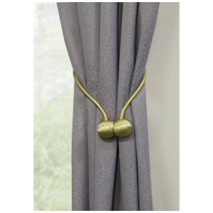 Fermaglio per tende Gardinia Flex-S dorato (48 cm) con chiusura magnetica su tenda grigia.