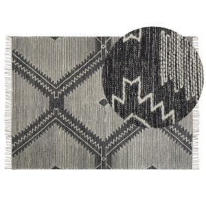Tapis Beliani Arbaa, coton noir, 140x200 cm, avec motif bohème géométrique et franges.