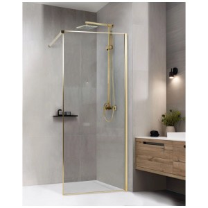 Paroi de douche Beliani Waspam transparente avec profils dorés dans une salle de bain moderne. Idéale pour douches à l'italienne.