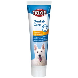 Trixie dentifricio per cani con olio di tea tree, tubetto da 100g. Tubetto bianco con design blu e cane sorridente.