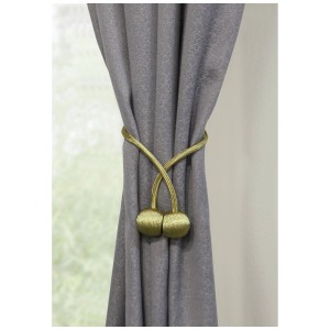 Fermaglio magnetico Gardinia Flex-S dorato che tiene una tenda grigia.