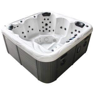 Spa d'extérieur blanc Sonnenkönig Sansibar avec jets de massage et habillage gris.