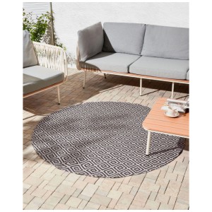 Runder Beliani Outdoor-Teppich Thrissur aus Polypropylen, grau-weiß mit geometrischem Muster auf Terrasse.