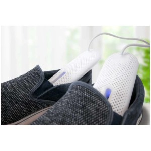 Séchoir à chaussures Sonnenkönig Aria Secco 4 utilisé dans des chaussures grises.