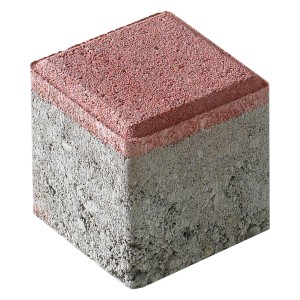 Pavé de remplissage rouge en béton pour dalles alvéolées, idéal pour le marquage des places de parking.