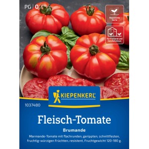 Graines de tomate charnue Kiepenkerl Brumande F1, tomates rouges côtelées sur une assiette.