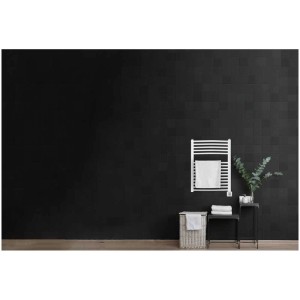 Radiateur sèche-serviettes blanc Sonnenkönig Nela 1 sur mur noir avec serviette.