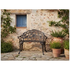 Banc de jardin Piura en aluminium marron foncé avec décorations florales, rustique, sur terrasse en pierre.