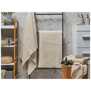Ensemble de 4 serviettes de bain Areora en coton beige avec texture gaufrée.