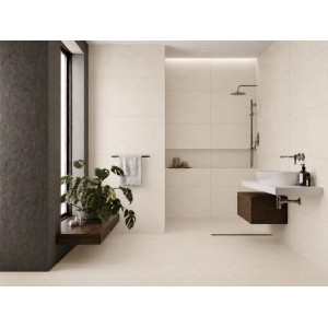Piastrella in gres porcellanato crema opaco, 59,8x119,8 cm, in bagno moderno con effetto cemento a parete e pavimento.