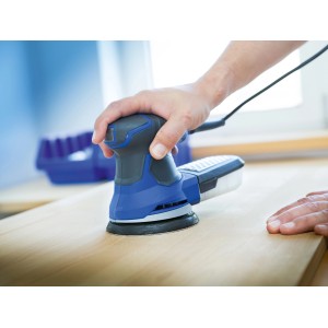 Ponceuse excentrique LUX avec abrasif K80 en utilisation sur surface en bois.
