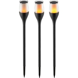 Trois bornes solaires LED noires avec effet flamme pour le jardin.