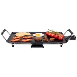 Nouvel Teppanyaki Grill 50, grill elettrico nero con cibo come gamberi, uova, pomodori.
