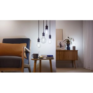Lampadina Philips Smart LED Filament, 60W E27 Edison, look vintage trasparente in soggiorno.