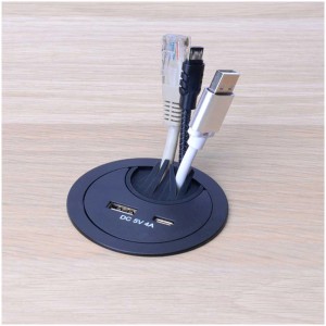 Passe-câble noir avec chargeur USB-A/C pour la gestion des câbles sur le bureau.