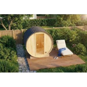 Sauna tonneau en bois FinnTherm Mini XXS avec chaise longue dans le jardin.