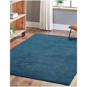 Tapis San Paolo Petrol, 130x190 cm, tapis à poils longs bleu pétrole dans un salon.
