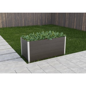 Jardinière surélevée grise en WPC (75x150x70cm) avec des plantes dans le jardin.