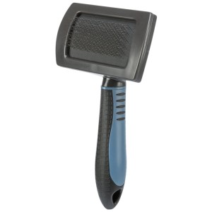 Brosse douce Trixie en plastique, 10x17 cm, pour un entretien doux du pelage des chiens.