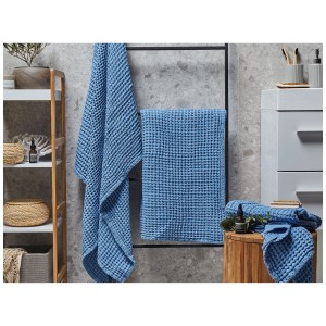 Set de serviettes de bain bleu Areora, 4 pièces, en coton avec texture gaufrée.